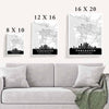 Living room adorned with a highly detailed Vancouver skyline art poster map print, offering a classic and minimalist aesthetic with touches of white and grey elegance